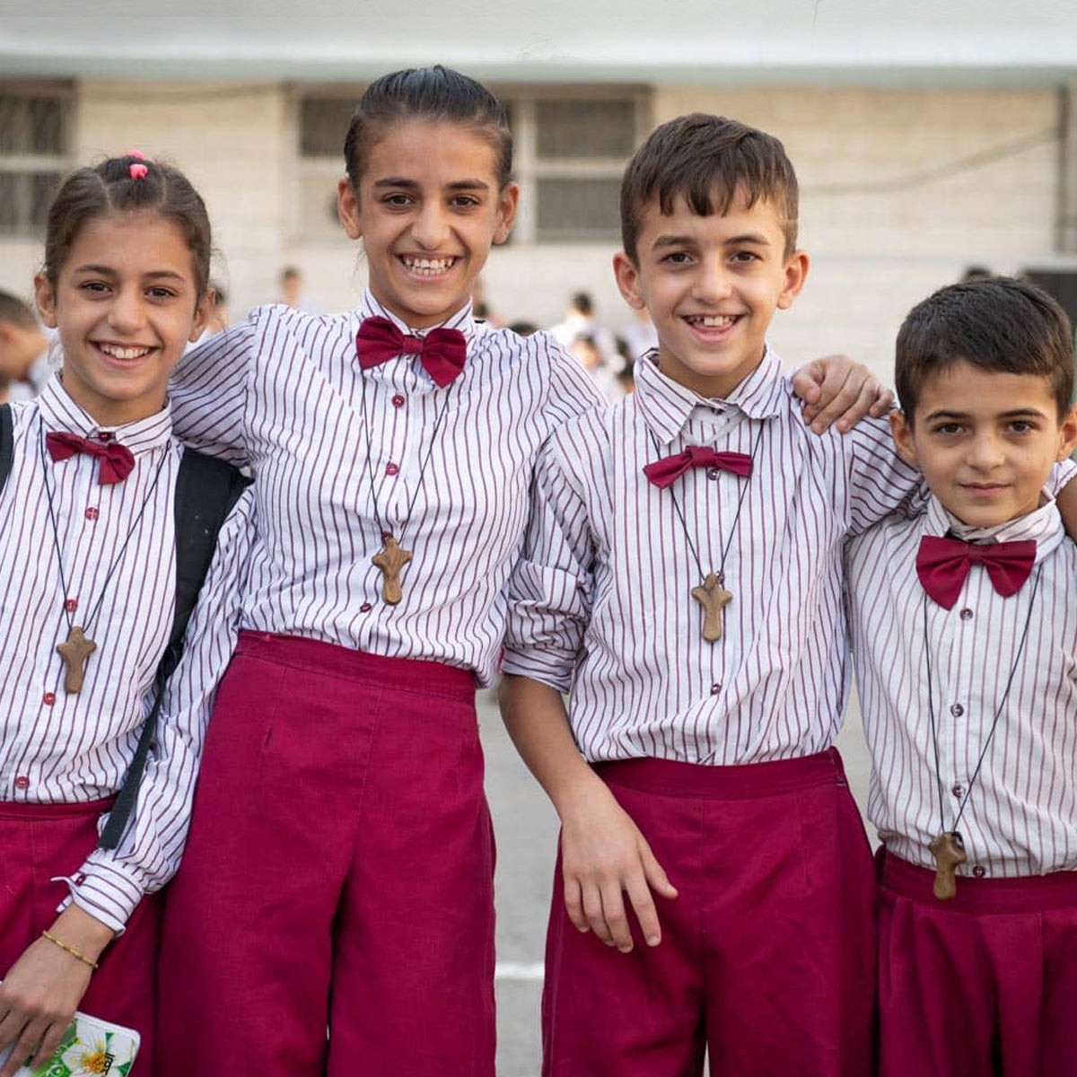 Wisam's children dressed in uniforms for school - part of their new life in a new land.