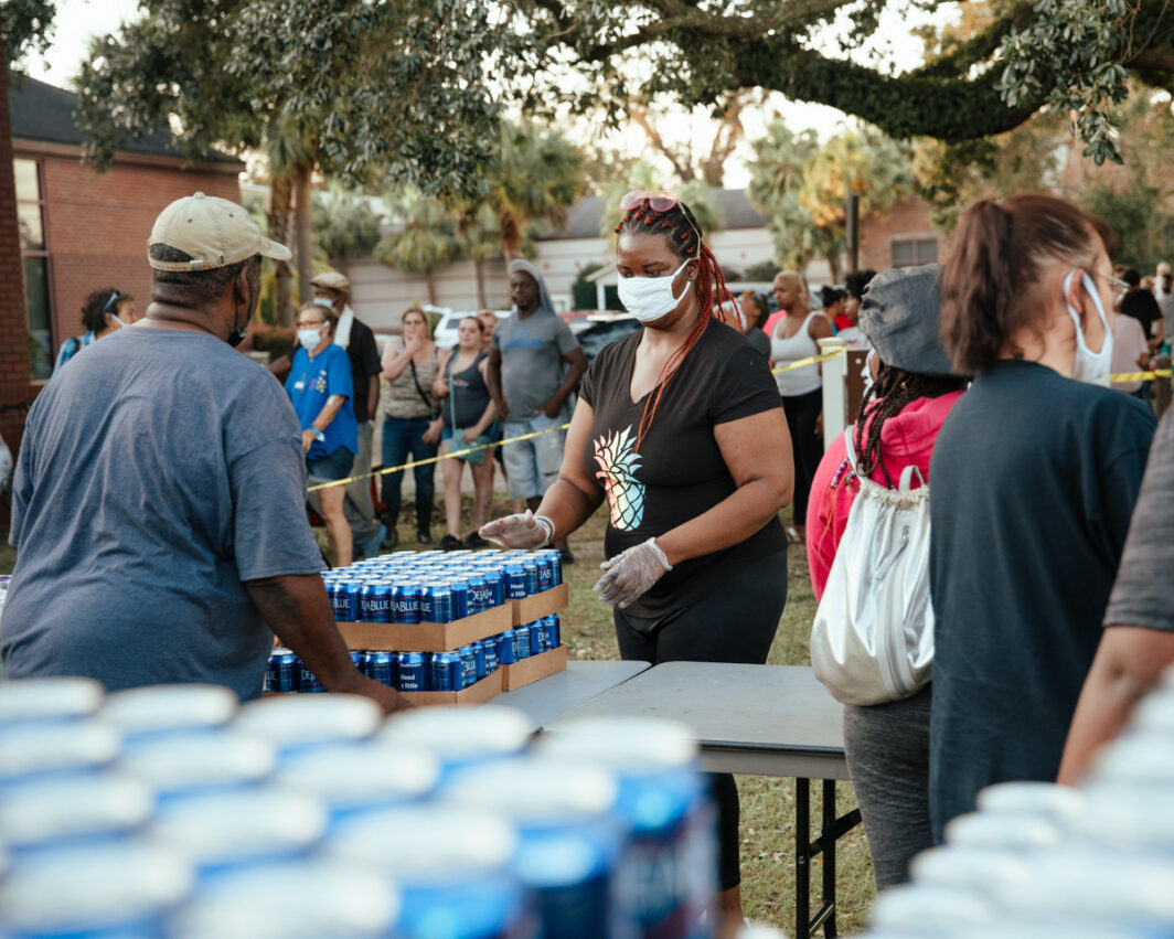 Distributing disaster relief supplies to Hurricane Sally victims