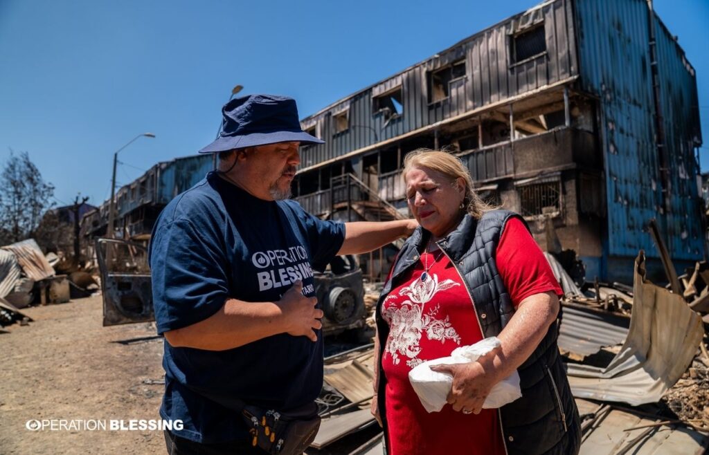 Resident Standing Amidst Rubble