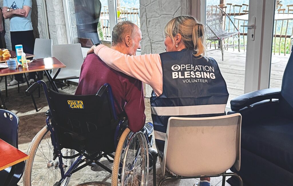 Volunteers transporting elderly evacuees to safety during the Ukraine conflict